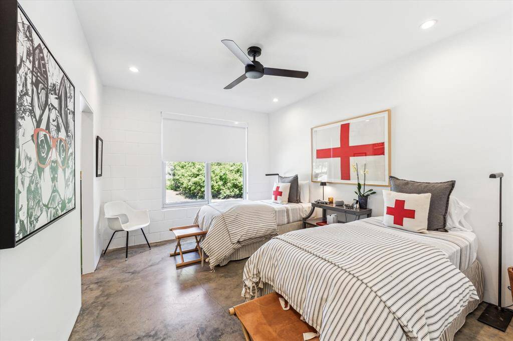 An amazing middle bedroom is ideal for multiple visitors or perhaps siblings. The huge picture window peers upon the gravel drive and trees entering the grounds and the opening on the left leads to a huge storage closet.
