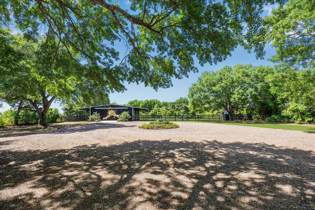 The gravel circle drive grants plenty of parking for multiple guests, ideal for a vacation rental or family get togethers!