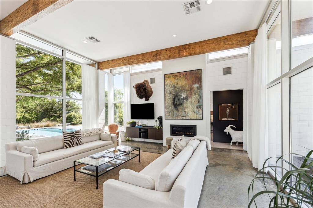 A fantastic family room to watch your favorite movies or sports teams, all while taking in the incredible views of the property that surrounds you. Or imagine drawing the shades and curling up with a book and blanket when the weather turns cold!