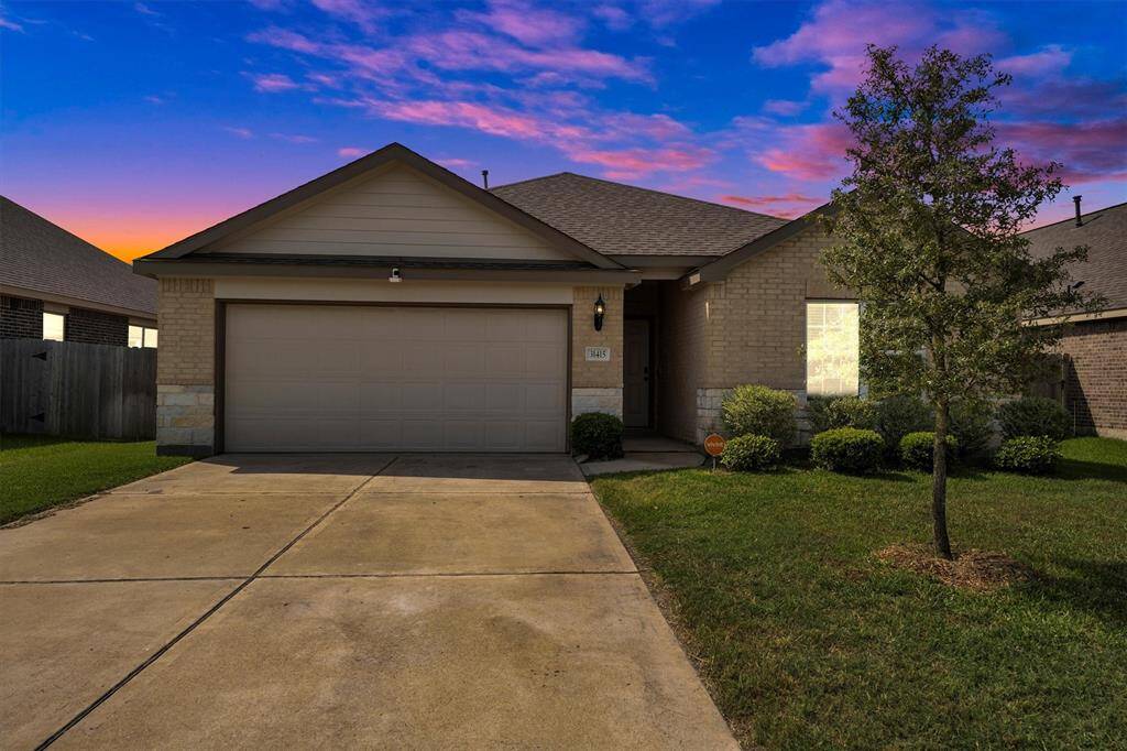 Charming single-story home with a welcoming front yard, attached two-car garage, and a cozy entrance. Perfect for comfortable living in a serene neighborhood.