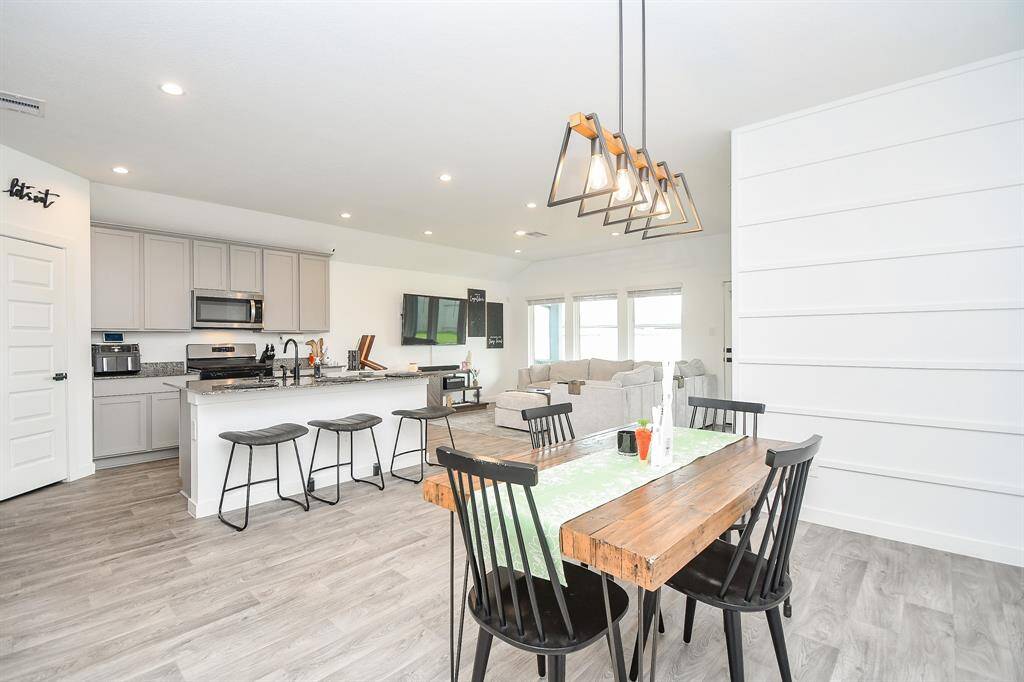 The living, the dining and the kitchen all flow together in this open concept
