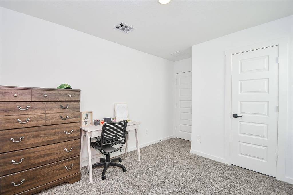 Bedroom number three used as an office, barely lived in