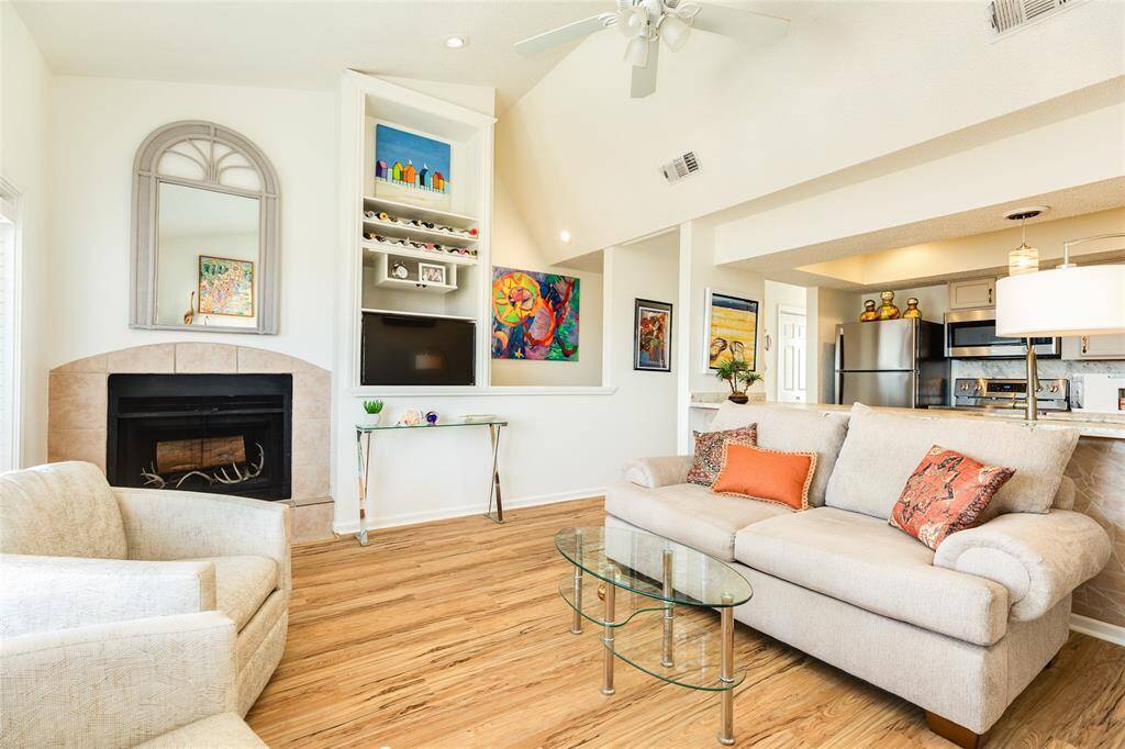 Showstopper alert! Take note of the custom built-in cabinetry in this space, the seller uses it without the doors but they are on-site if you wish to attach them. Yes! The fireplace works, it's wood-burning.