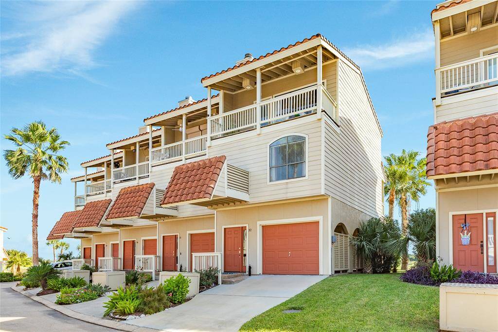 Beautiful landscaping and a well-maintained fiber cement exterior on this interior corner unit with extra greenspace beside your home.