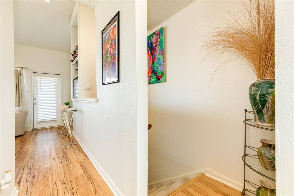 The living area is on the top level and is warm, open, and inviting.
