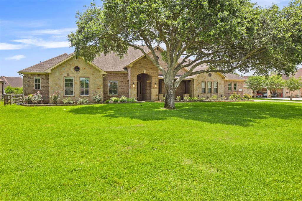 Welcome home! This beautiful, 1-story home is located on a quiet street, and centrally positioned on a sprawling one-acre property. The juxtaposition of stone, brick, and wood makes for a warm and inviting exterior that is sure to please just about any pallet. Some features that set this home apart from the rest are the wood paneled ceilings, the gourmet Kitchen, spacious Laundry Room, and spectacular Back Patio.