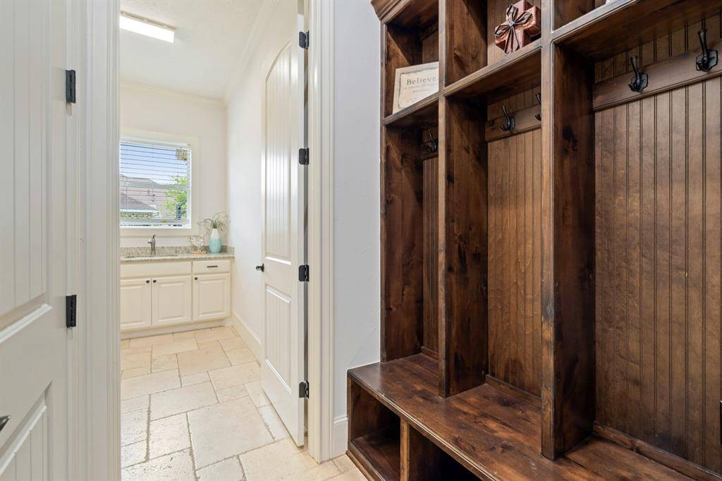 Built-in cubbies make it easy to store backpacks, coats, and shoes for a family on the go. Located between the garage entrance and the Laundry Room, this storage unit is very convenient.