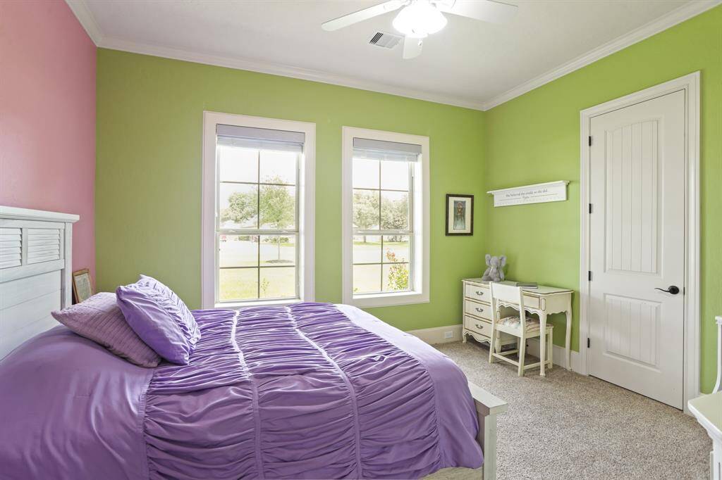 This Secondary Bedroom has all the same features as the previous bedroom, only this one includes two cased windows overlooking the lush Front Yard and grand oak tree.