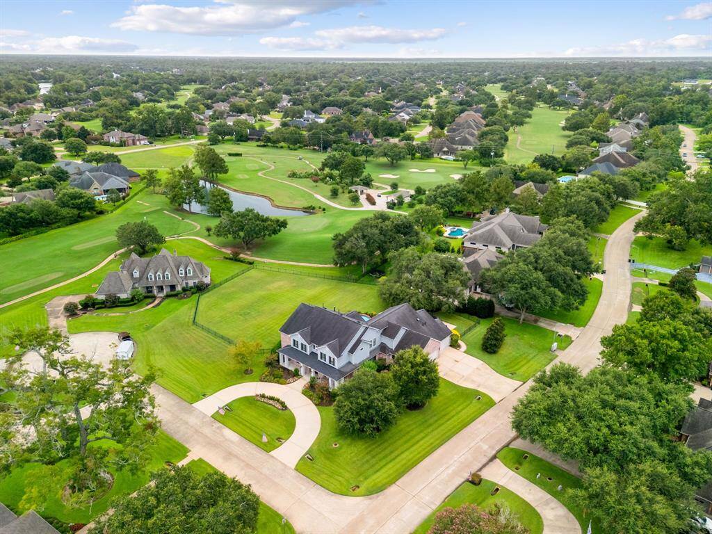 Aerial view of the expansive property and ideal location for this home. The vacant lot next to the home is also available and can be purchased with the home.