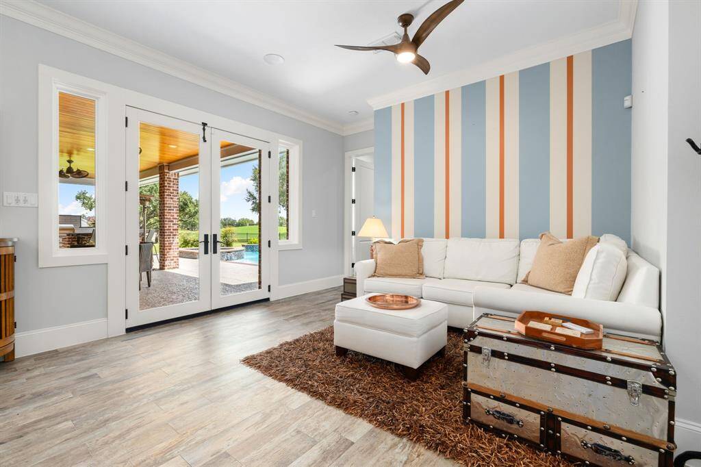 Enhancing both convenience and ambience, the sunroom or casual and cozy living space is thoughtfully positioned near the breakfast and kitchen.
