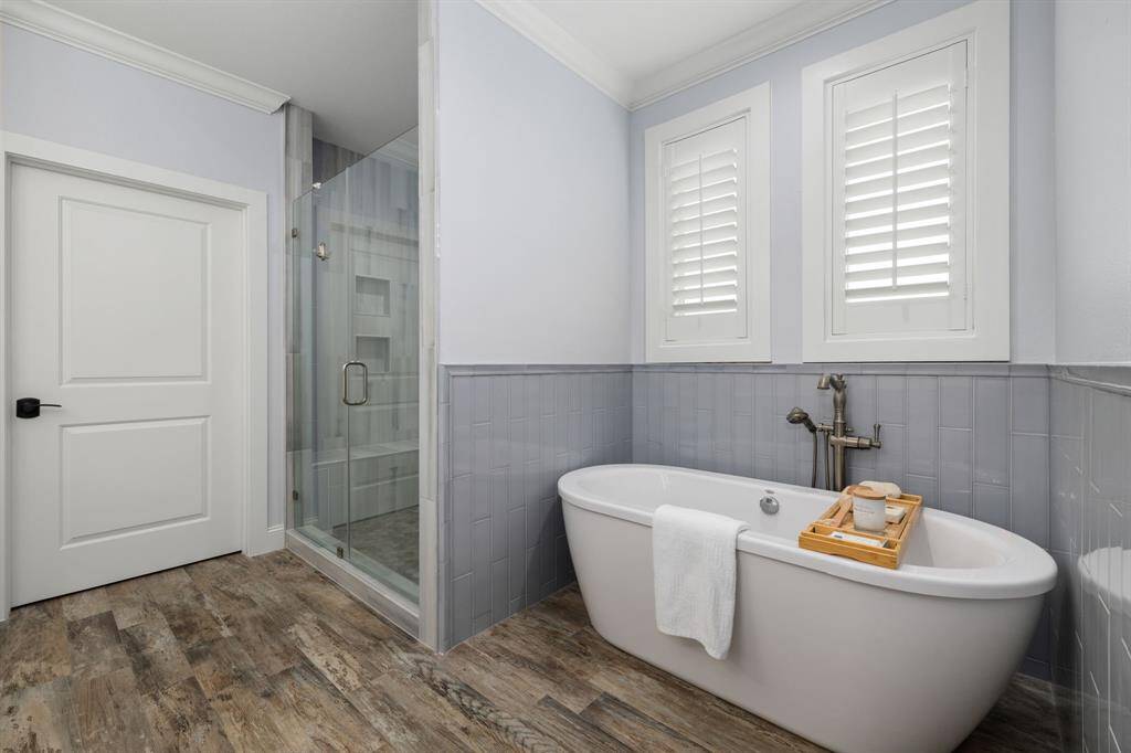 In addition to the large shower, the oversized freestanding soaking tub invites you to unwind and indulge in luxurious serenity.