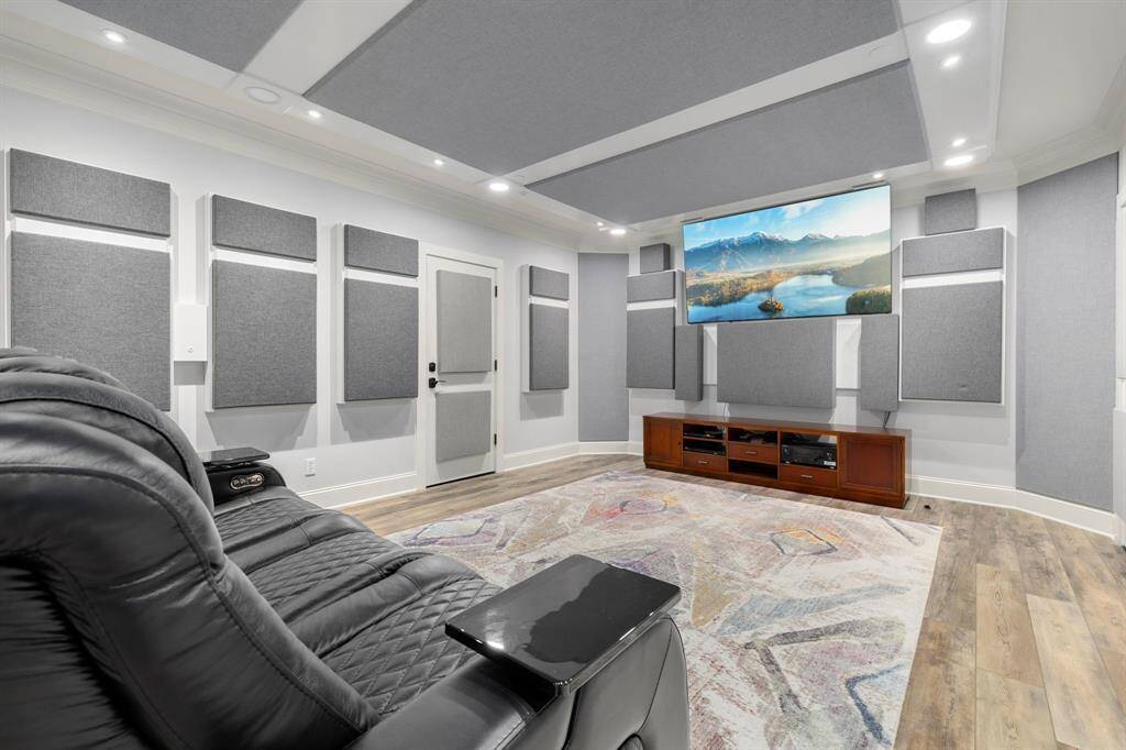 Your own private theatre room features custom lighting and sound deadening walls and panels.