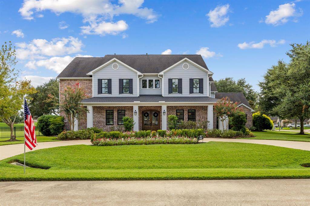 Texas brick with schmear mortar, dormars, lincoln aluminum clad wood double pane windows wrap around porch with pine ceiling, and bevolo handcrafted gas copper lanterns.