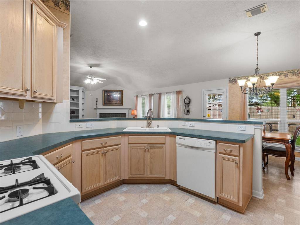 This versatile kitchen offers abundant counter space and overlooks both the dining room and family room, keeping everyone connected whether you're cooking or entertaining.
