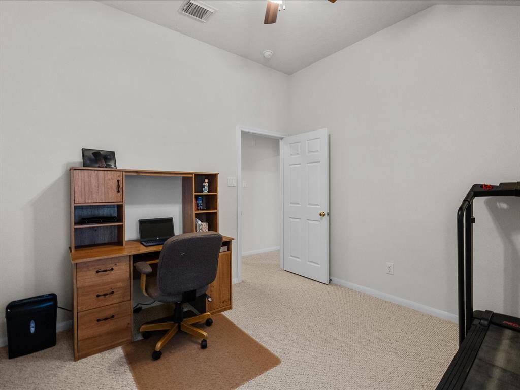 Bedroom 3 is a versatile space—currently used as an office, but easily accommodates a full bedroom setup with plenty of room to spare.
