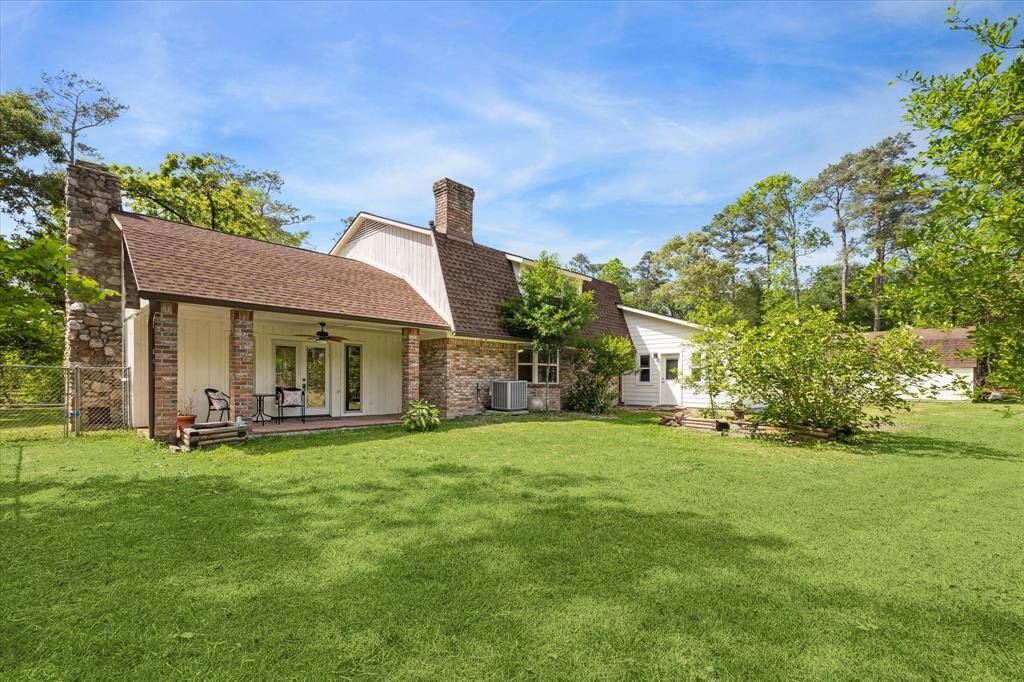 Back of home with covered patio