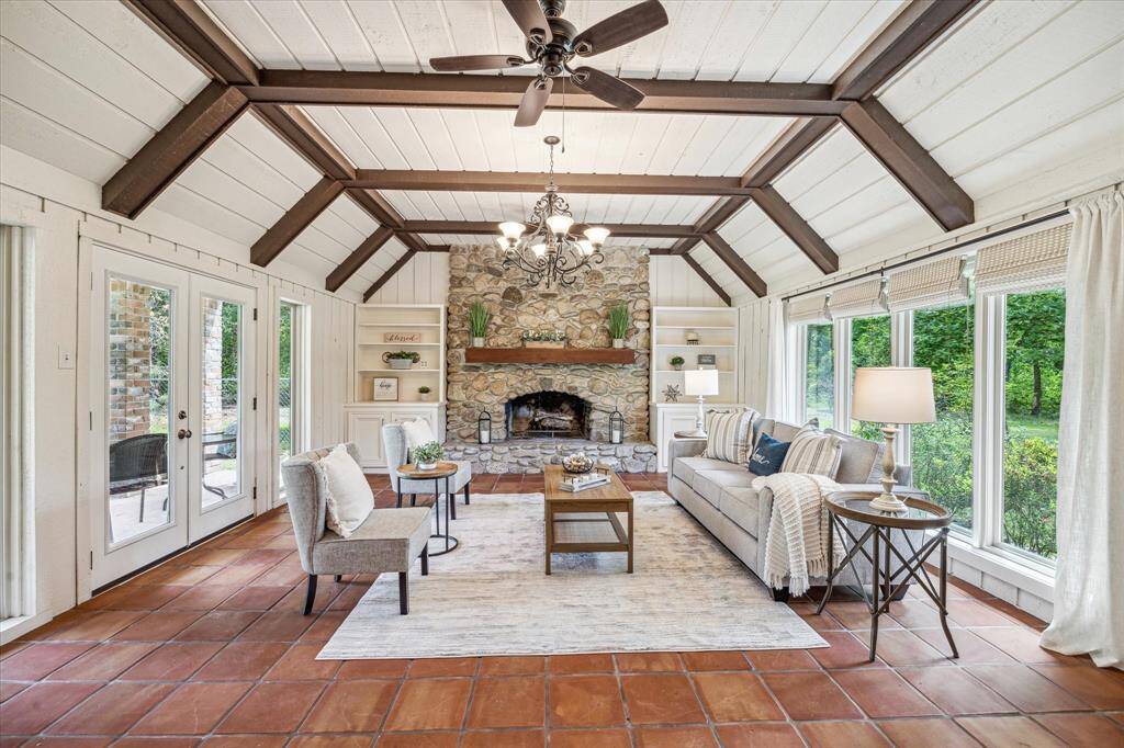 Ligh and bright living area with stunning stone fireplace!