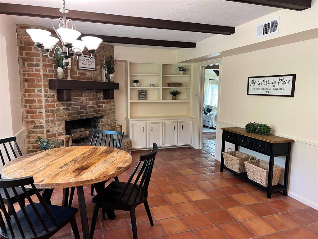 Large Dining area with wood burning fireplace and built-in.