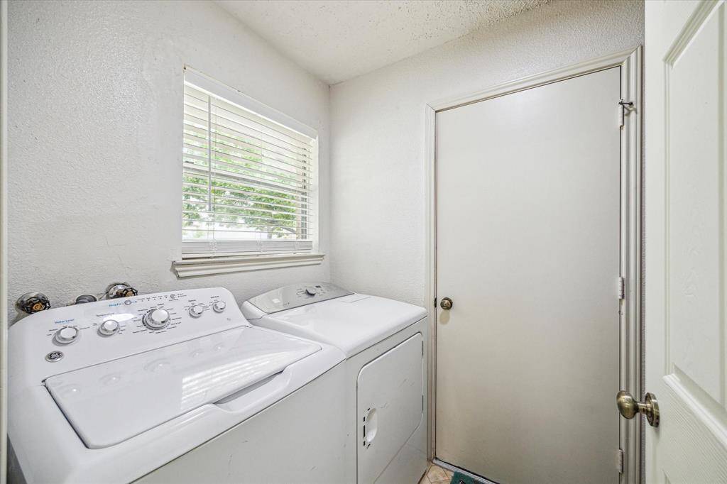 Laundry room with access to garage.