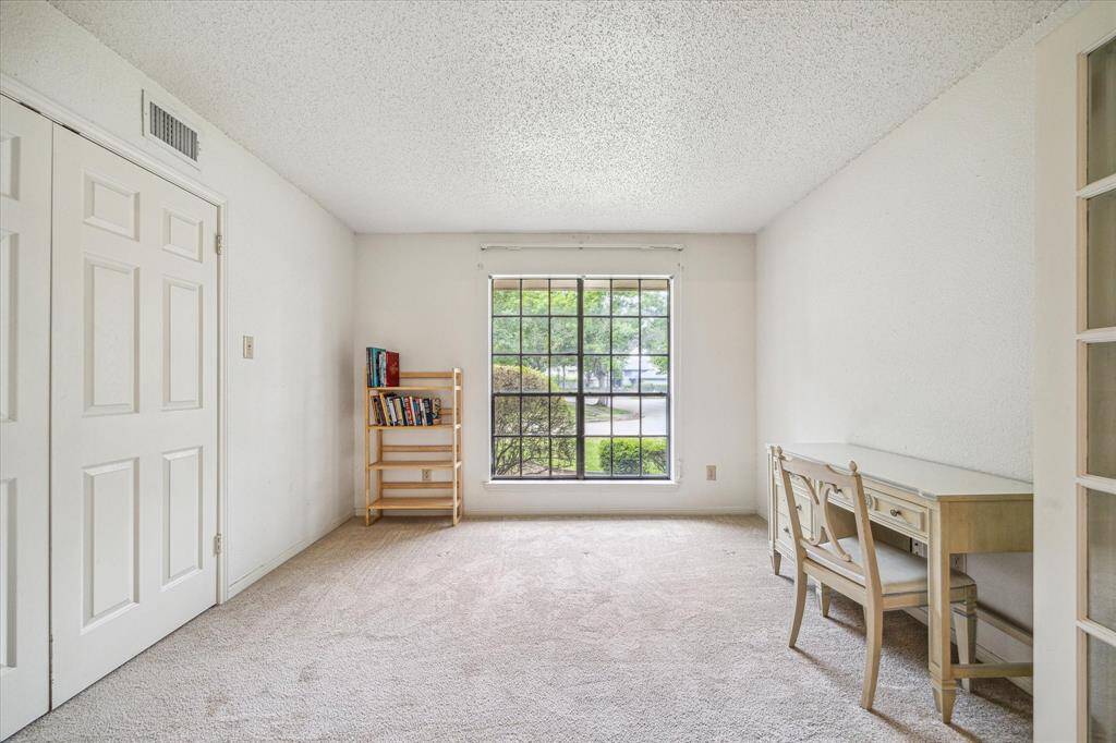 Study with double doors to foyer and double glass doors to dining room.