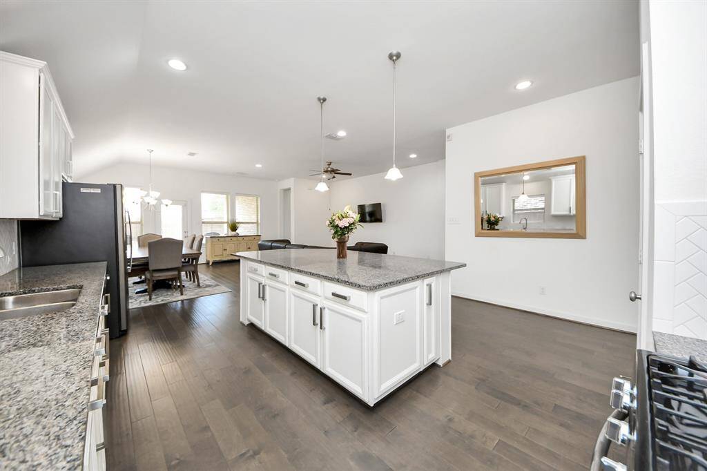 This space opens directly into the expansive family room, creating a natural gathering place filled with light and warmth.