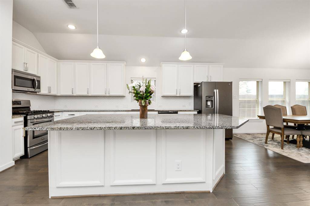 Whether you're cooking, relaxing, or hosting, this open-concept space offers the perfect balance of comfort and convenience.