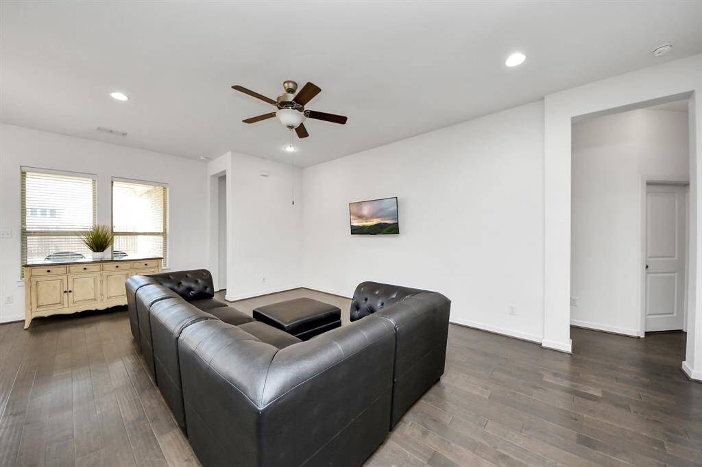 Designed with modern living in mind, the open-concept layout seamlessly connects the kitchen, dining area, and living room into one expansive, light-filled space.