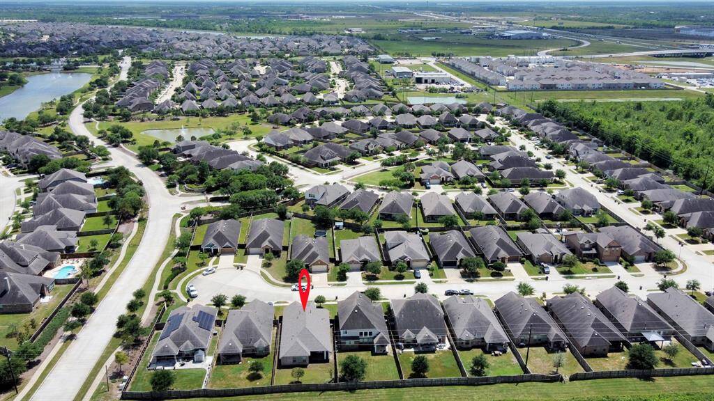 This exceptional property is nestled within a community that offers an array of resort-style amenities.