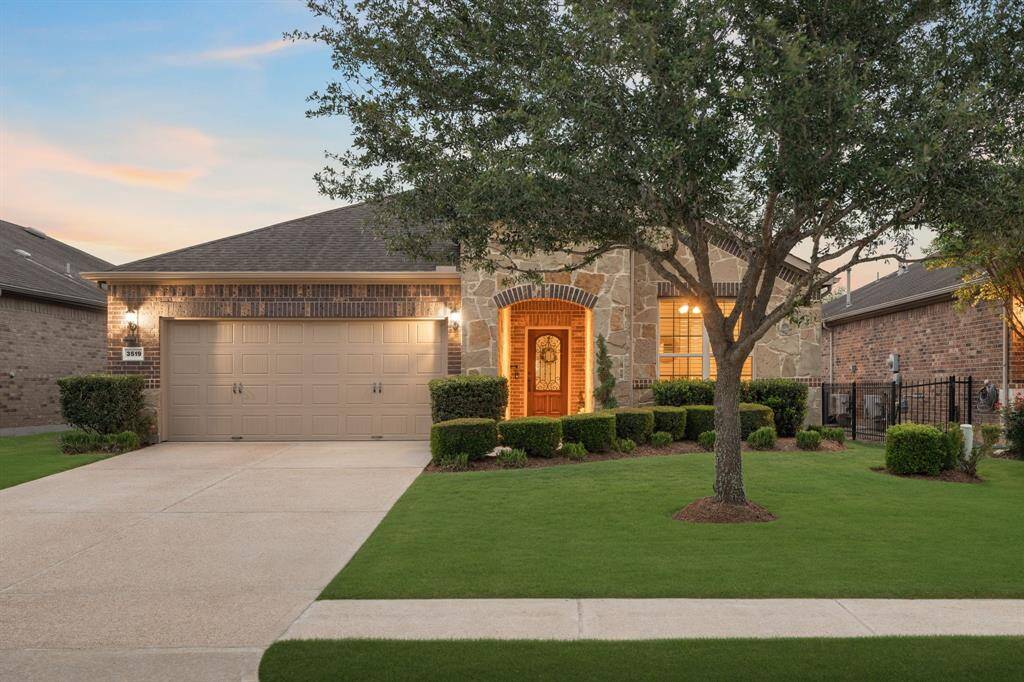 Welcome to this beautifully upgraded Tifton Walk, where the elegant mosaic stone archway sets the tone for the warmth and charm found throughout the home.