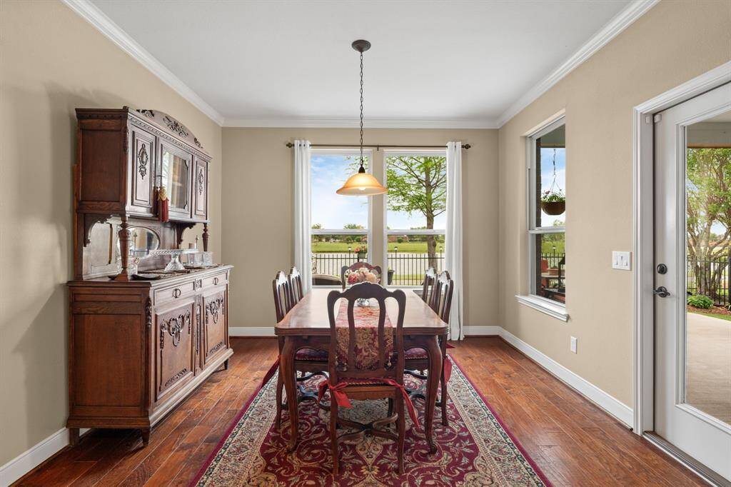 With plenty of wall space for your favorite furniture and elegant crown molding, this room also offers a peaceful view of the serene lake and lush landscaping—making every moment feel calm and refreshing.