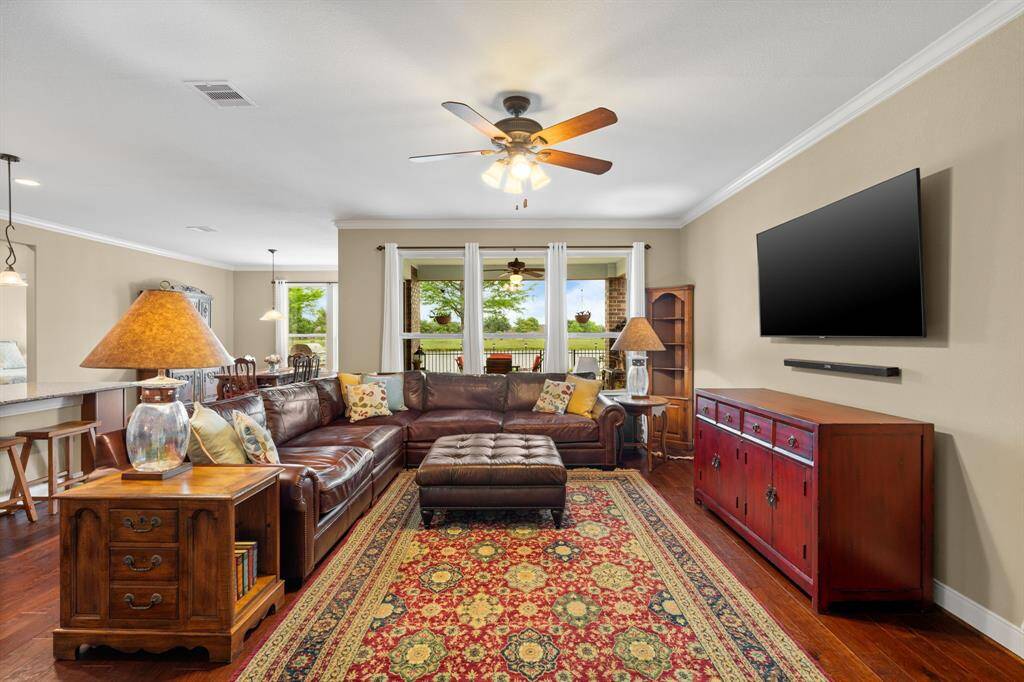 This versatile living space offers endless furniture arrangement options, all designed to make the most of the outdoor beauty that beckons you outside.