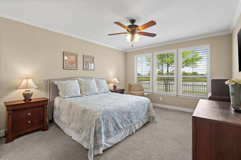 The owner’s suite offers plenty of space for a king bed, two nightstands, and ample wall space for a dresser—creating a comfortable and functional retreat.