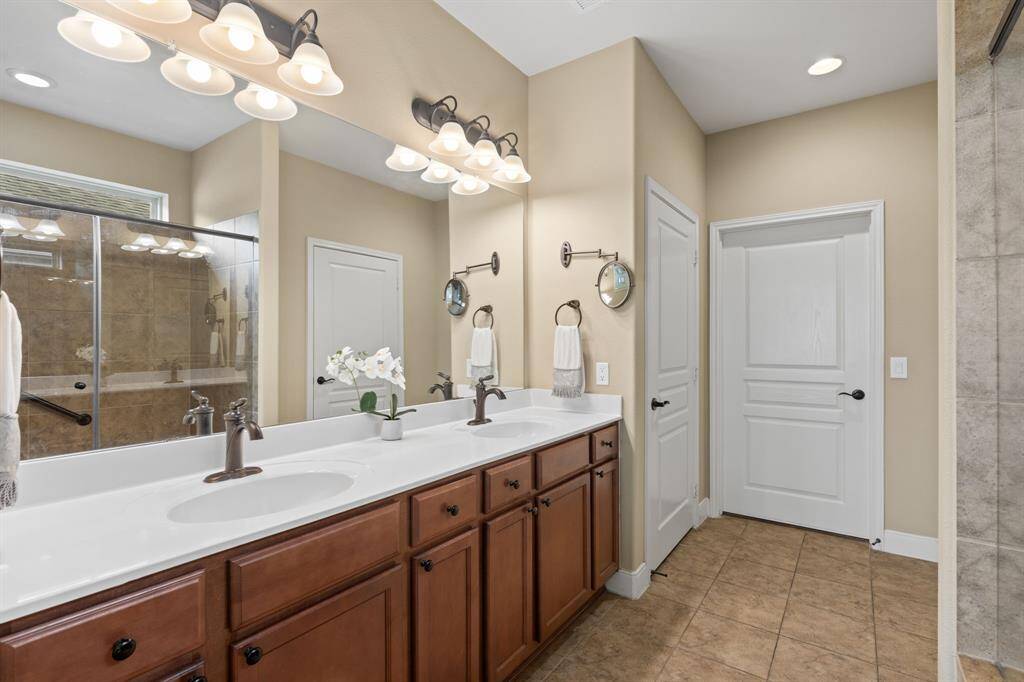 Dual sinks and plenty of counter space provide the perfect setup for comfort and convenience, making daily routines a breeze.