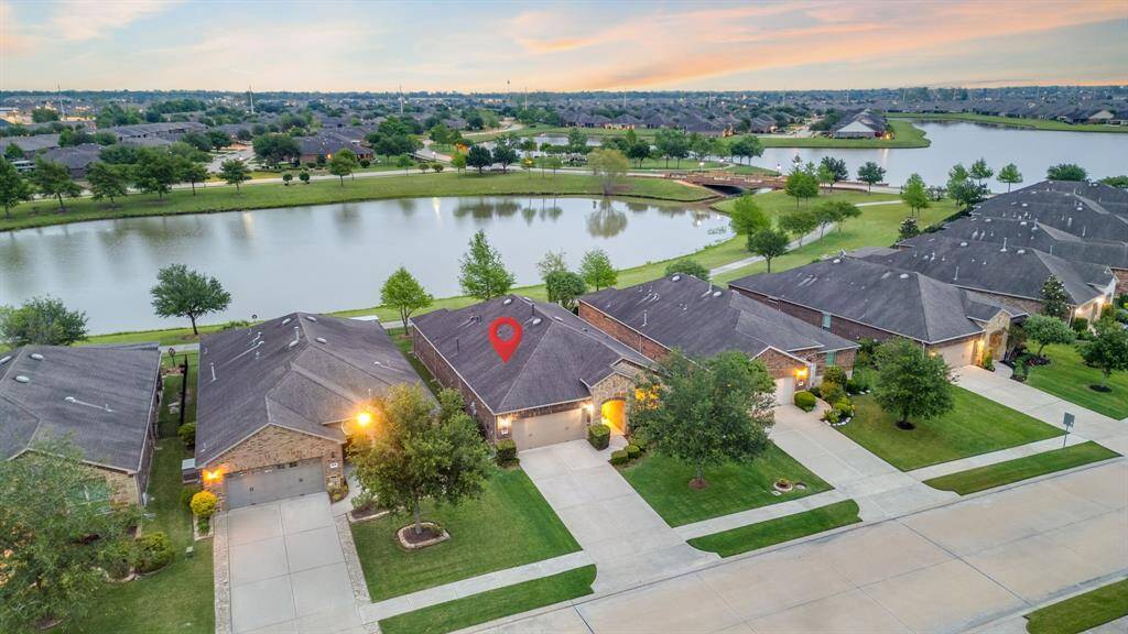 Location, location! Enjoy stunning views of the Del Webb bridge and the serene lake right behind the home—truly a breathtaking backdrop.