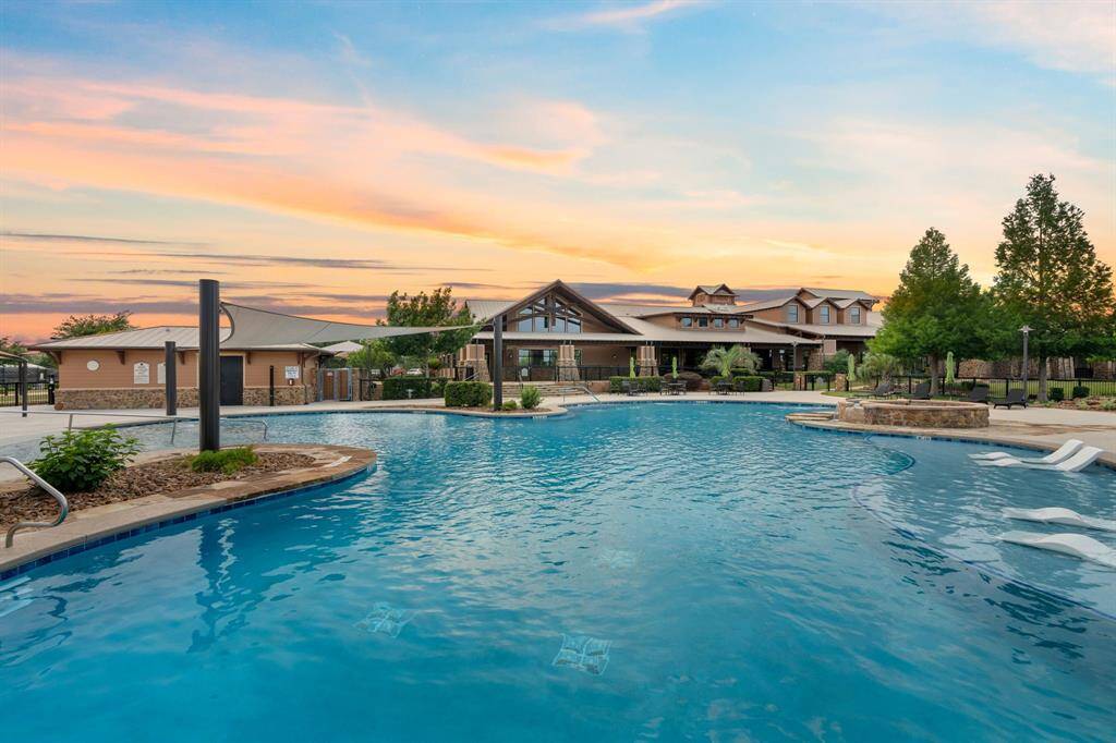The outdoor pool is the perfect spot to unwind, especially after a hot Texas day—cool off and relax in this refreshing oasis.
