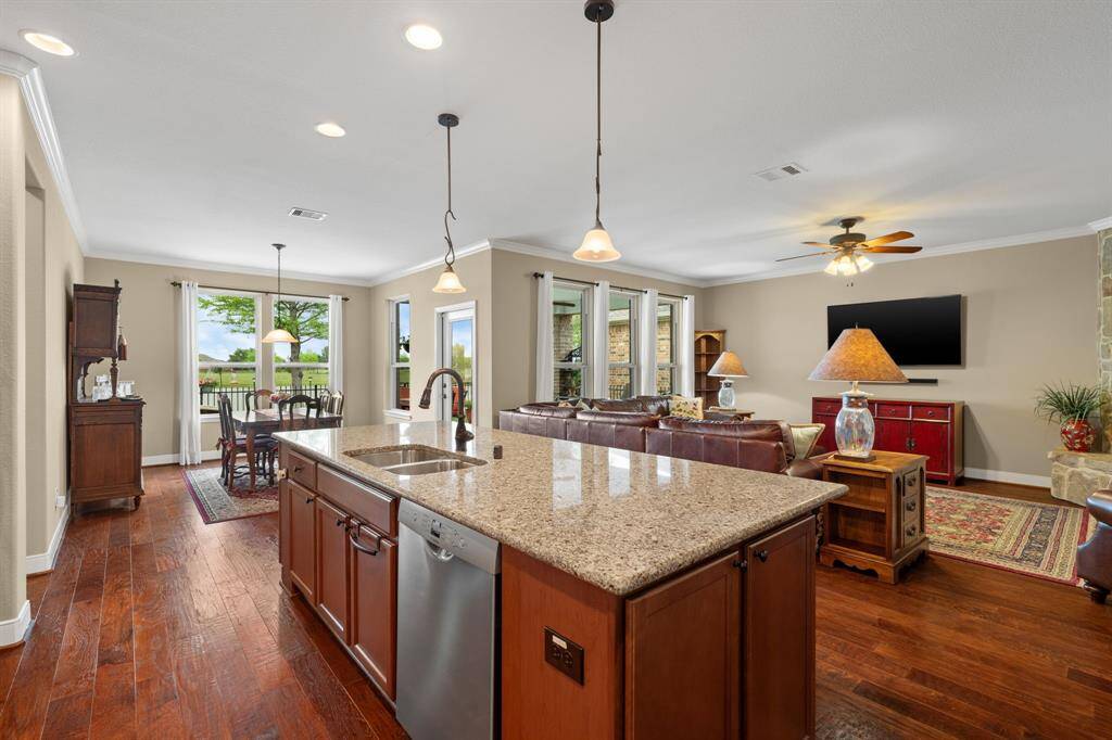 Six large windows draw your gaze to serene lake views and lush, mature landscaping—bringing the beauty of nature right into your living space.