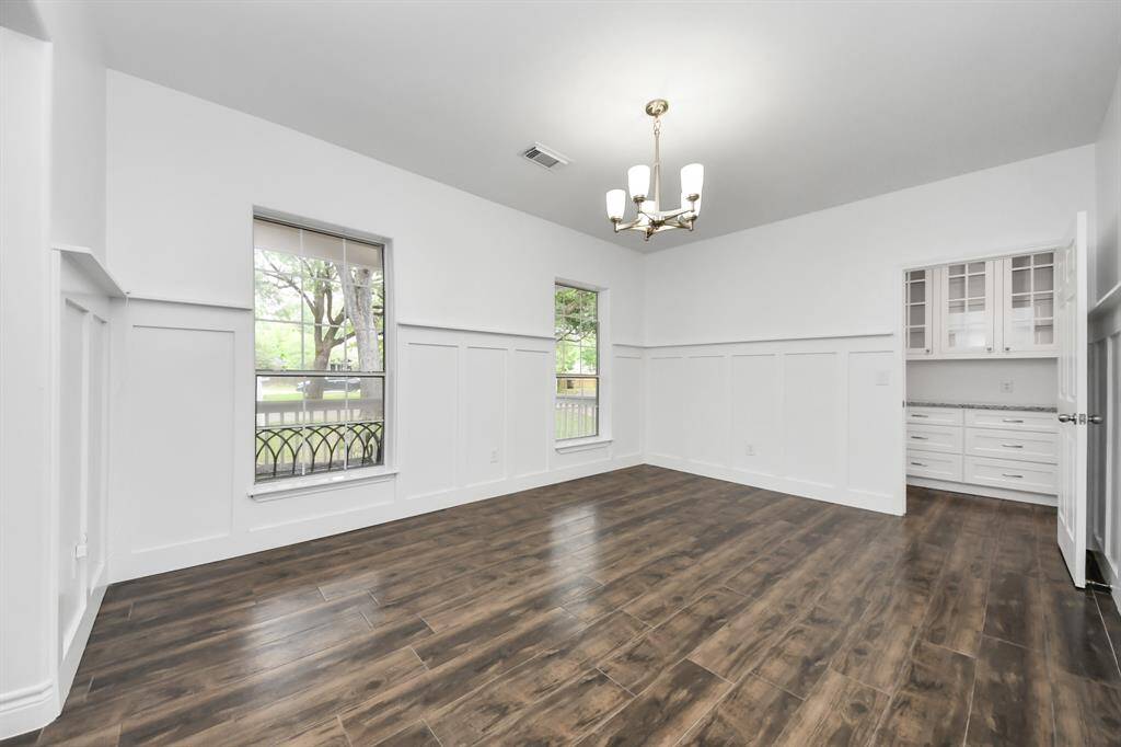 Virtually staged formal living area, could be used in other ways, such as play room, game room, second office or more