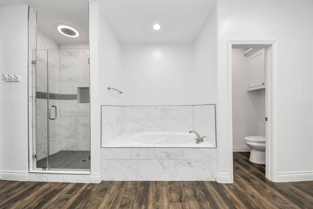 Shower, soak, or, sit, this bathroom covers all those needs!