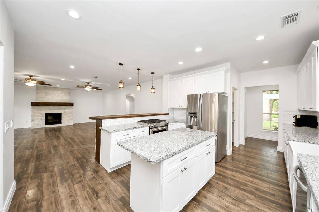 The gas stove is perfectly located so you can entertain and keep the cooking going if you wish.