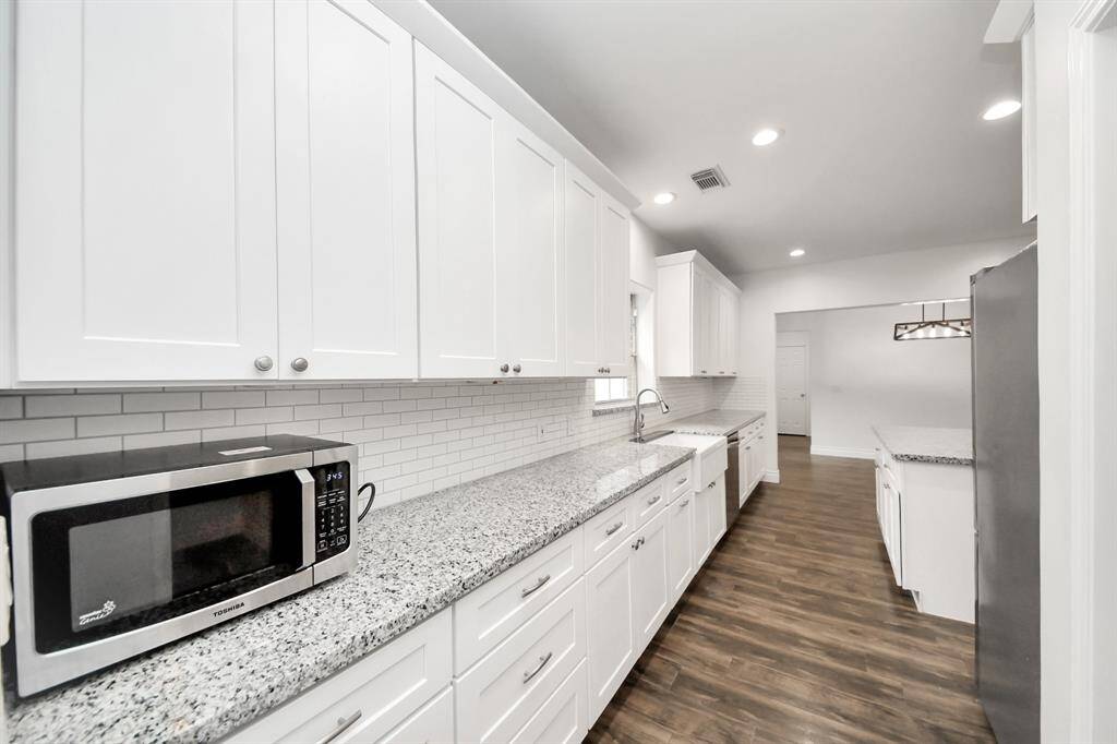 Tons of counter space and cabinetry for storage.