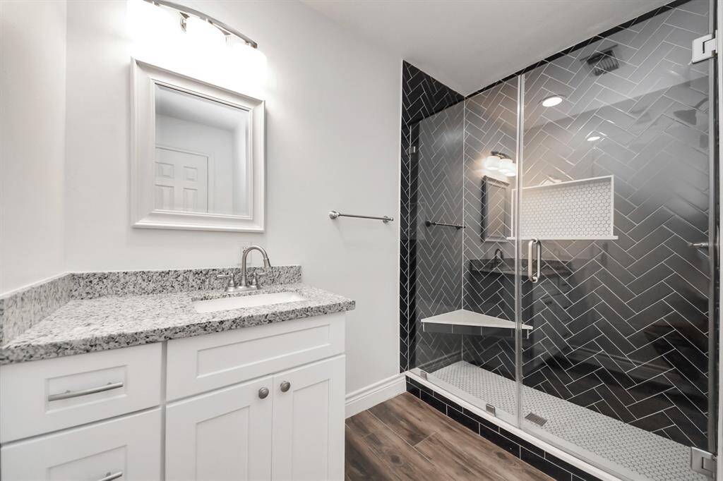 Upstairs Bathroom has elegantly updated shower