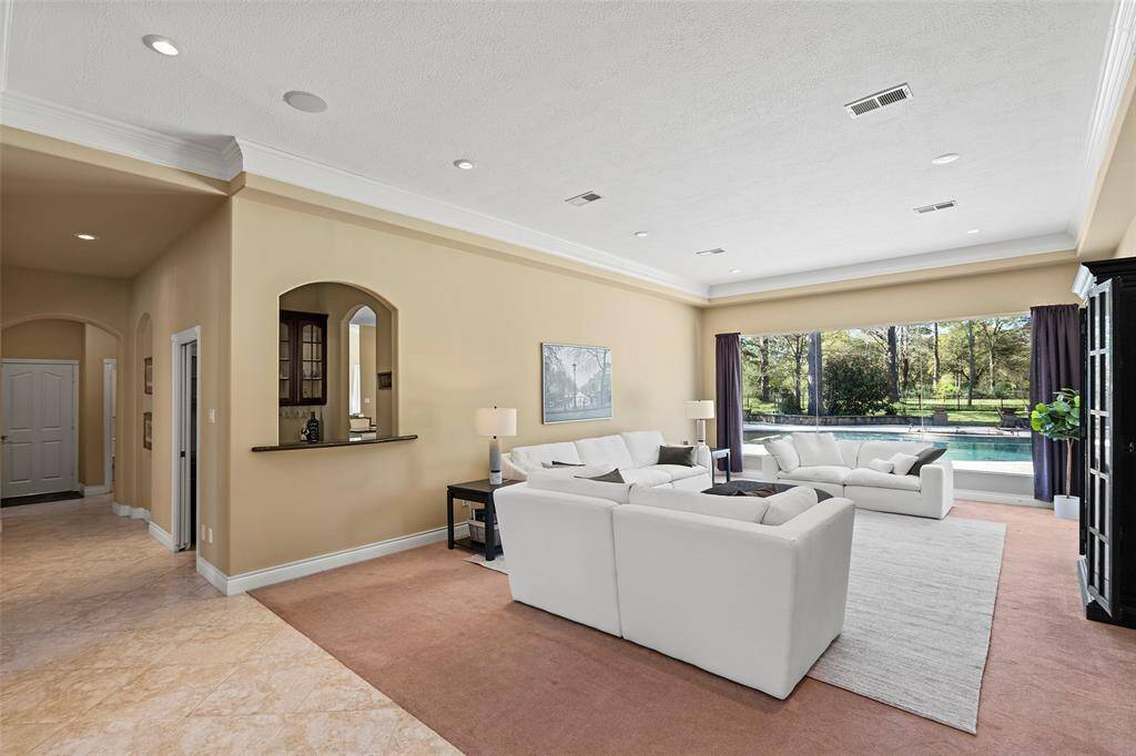 Having friends over for the evening, enjoying a glass of brandy after an exquisite meal just seems so inviting in this formal space! Or if you ever just want to sit away from the hustle and bustle of the active kitchen and family room, read a book or just relax, then this formal living room is the space for you!