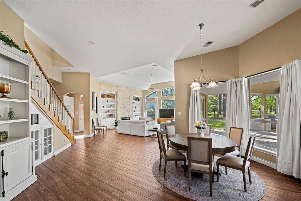 This open floor plan has amazing views throughout the home! It's light, bright and so heartwarming! Gorgeous wood tile flooring flows throughout these main living areas creating a seamless look that is so easy to maintain!