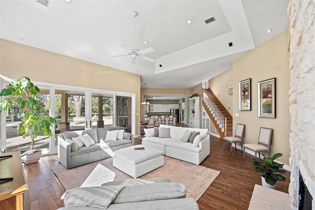 This home offers a second set of stairs providing quick access to the upstairs living spaces, for those nights of sneaking down for a midnight snack! This angle also shows the wonderful set of sliding glass doors opening up this home after a long stuffy summer of A/C, or those tantalizing nights of indoor/outdoor entertaining!