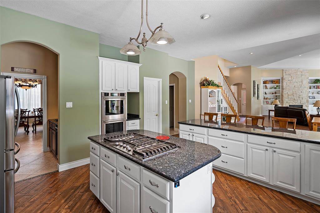 This kitchen is fresh and clean and beams with pride with the recently installed stainless appliances that includes a 5-burner gas cooktop!