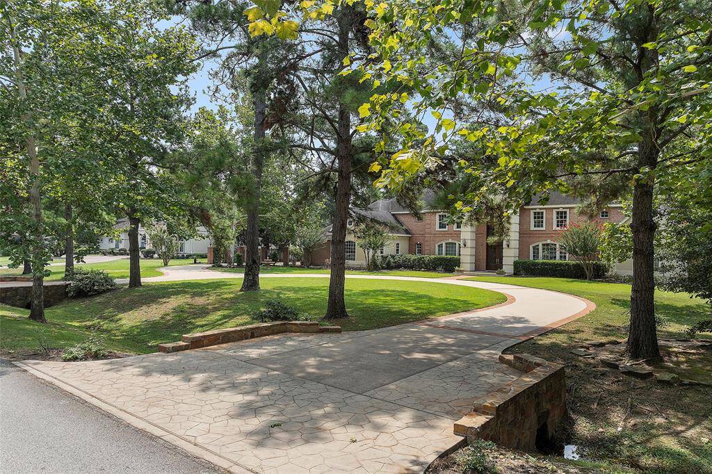 As you come upon the property, you immediately notice the patterned driveway, with brick lined edging and the stone accented crossovers! This property is surrounded by a variety of mature trees perfect for bird watching or maybe filling up with Christmas lights for the season!