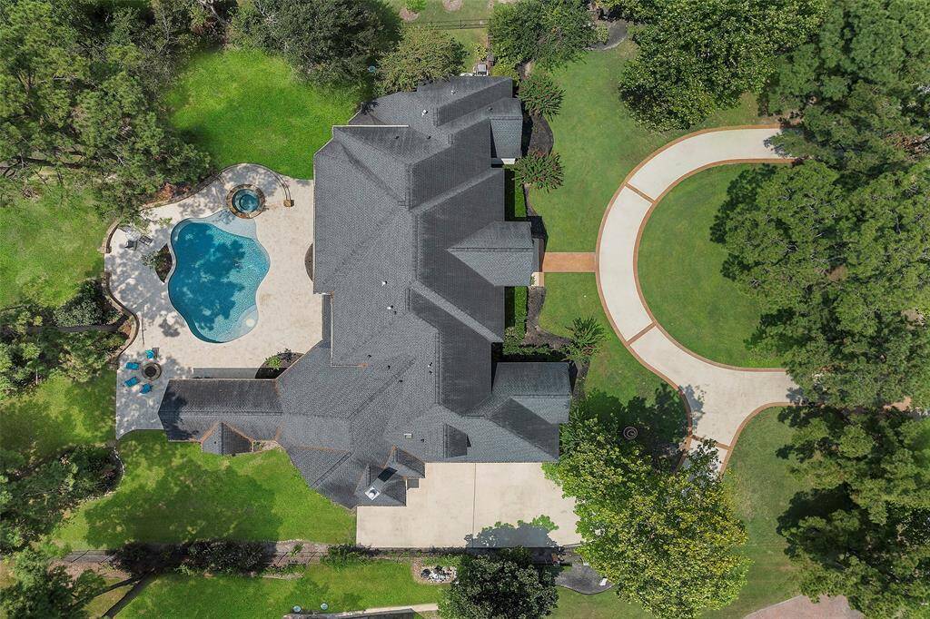 This aerial view just says it all! WOW! From the custom circle driveway to the manual gated auto-court to the ENTERTAINER's backyard dream with HUGE pool and spa! This home has it all!