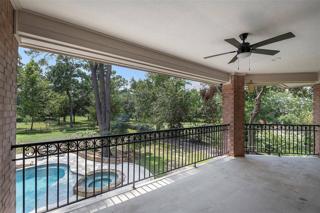 Here is the tree-lined view you get with this balcony space! Evenings sitting outside, listening to the chatter of the adjacent golf course, or critters and crickets chirping with joy in the evening air! A breezy fan keeps it all comfortable in the shade!