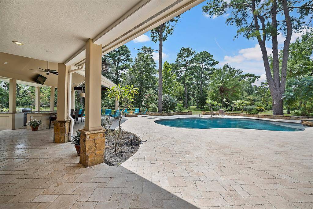 Let's go outside and discover this FABULOUS outdoor entertainment area that will surely be the most loved space is this home! A HUGE, sparkling pool and spa stands ready for long lazy summers, or cool winter nights at home!