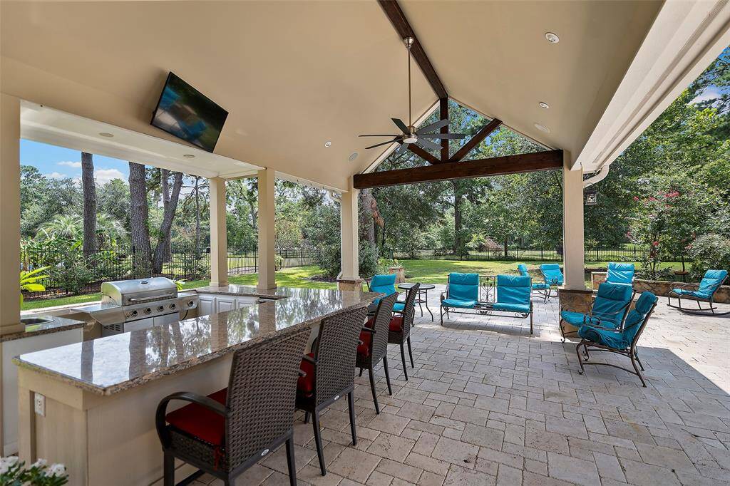 This covered outdoor patio space boasts an outdoor kitchen and expansive bar space for enjoying freshly cooked burgers, steaks, hot dogs or veggie kabobs! Imagine spending evenings watching the Astros chase the pennant with all you hold dear, enjoying the fruits of your labor!